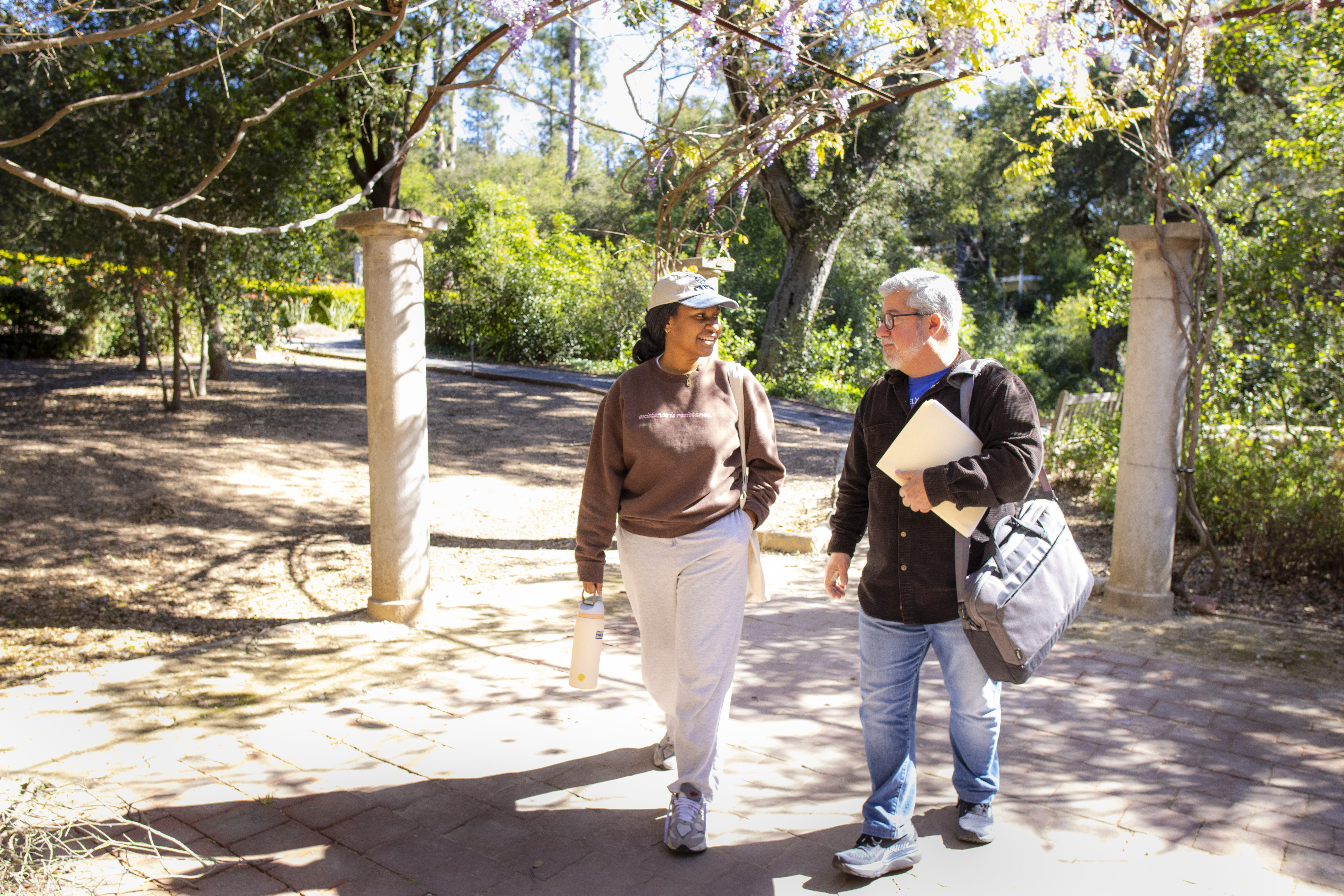 faculty walking with student