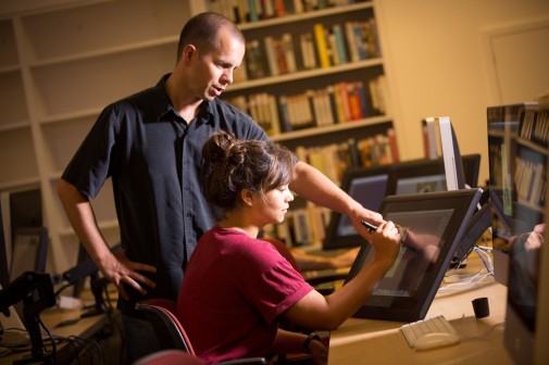 Professor Scott Anderson explains the functions of the Cintiq graphic tablet in a digital painting course