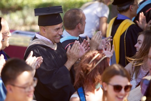 Silvio Vazquez, dean of admission, greets new students