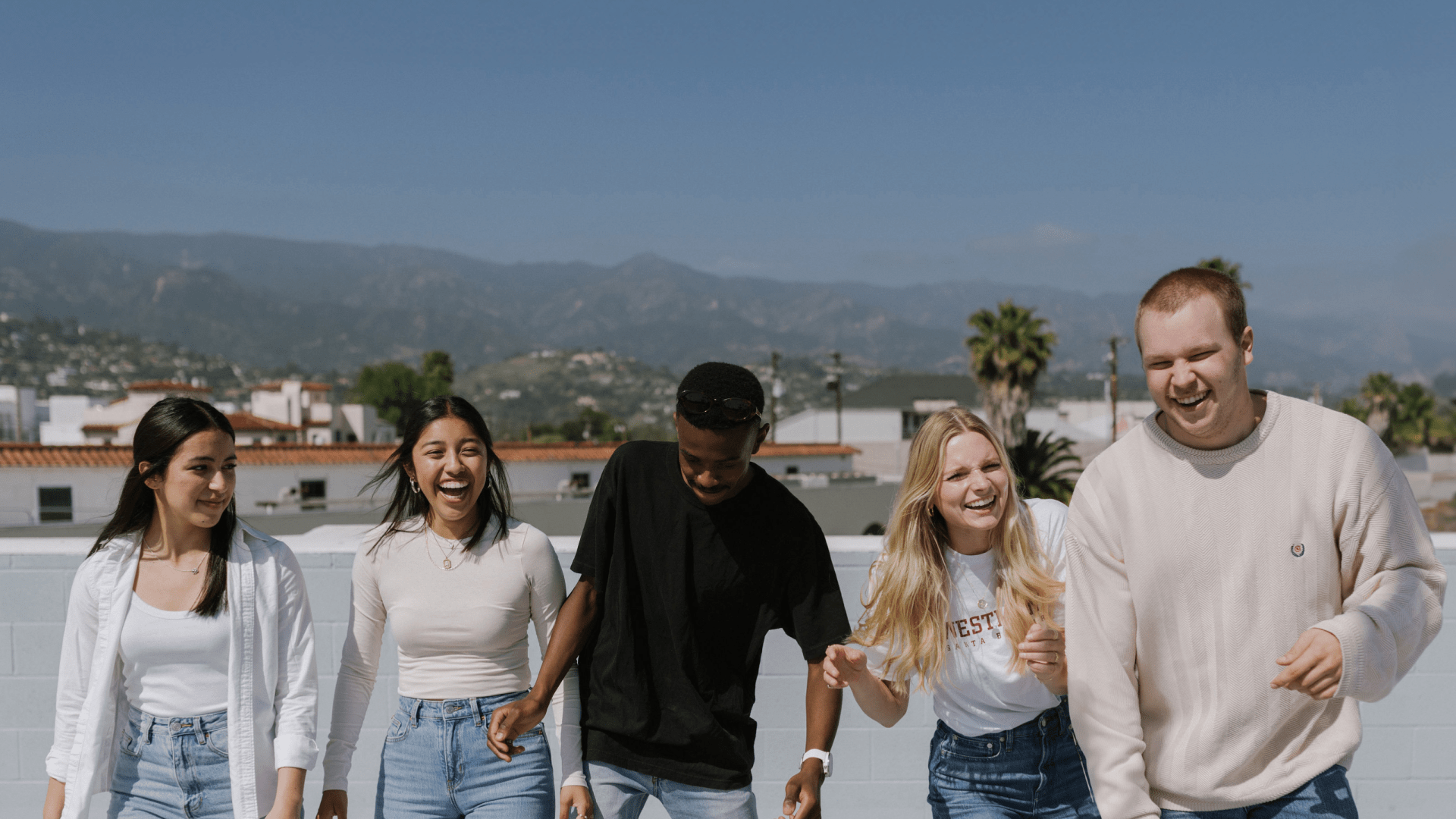 students walking together with mountain views