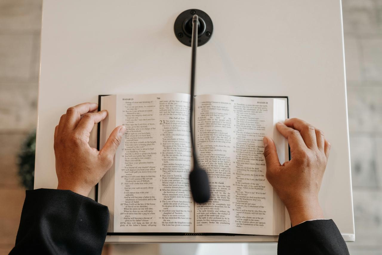 Photo by Pavel Danilyuk: https://www.pexels.com/photo/person-standing-behind-a-podium-with-a-bible-8815042/