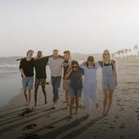westmont students walking on beach